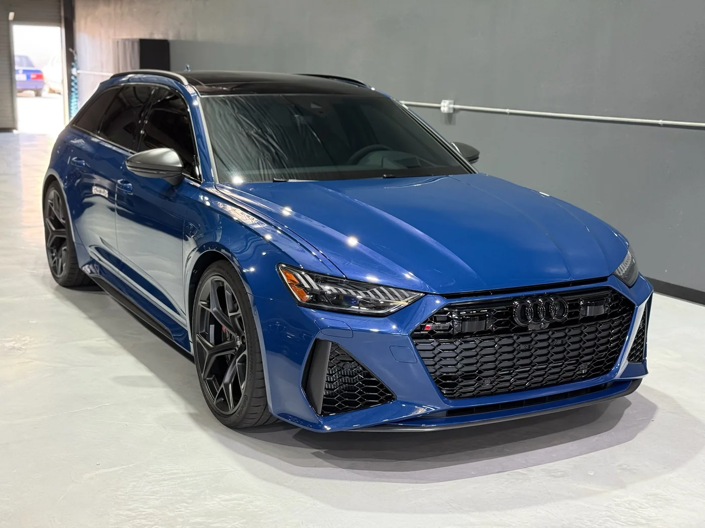 Blue Audi RS6 Avant with freshly tinted windows at Artec Automotive in Belmont, CA