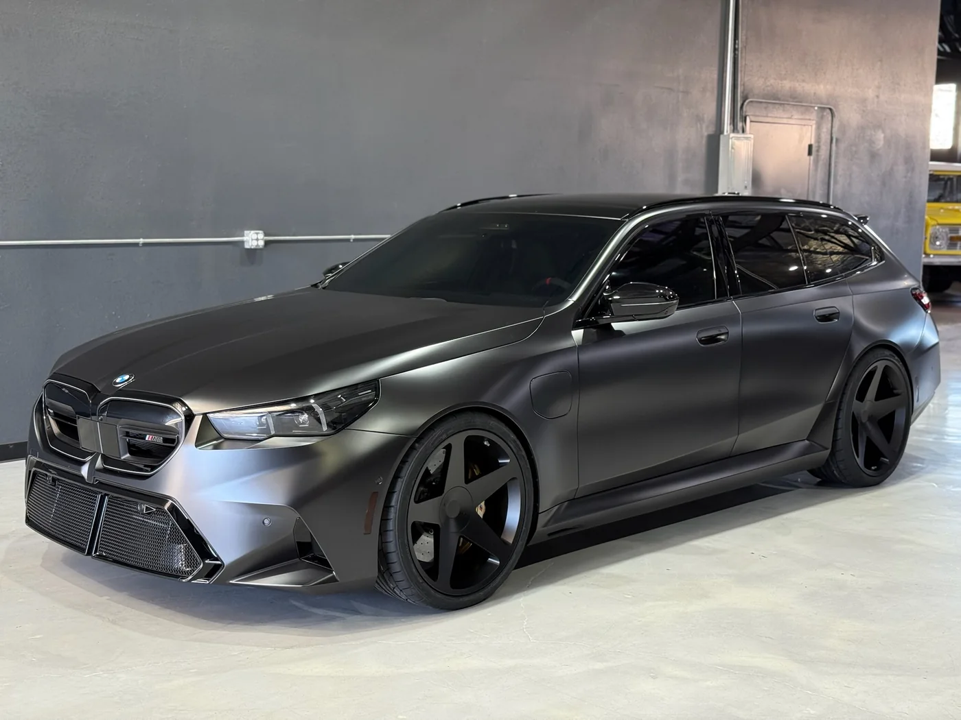 Matte grey BMW M5 Touring with ceramic window tint fitted at Artec Automotive